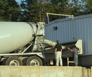 Man checking the truck — Concrete Construction Service in Lowell, MA