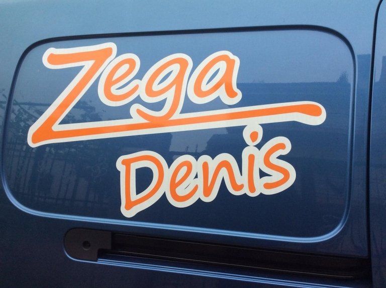 insegna Zega denis