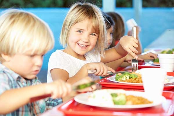 Pupils enjoying healthy lunch