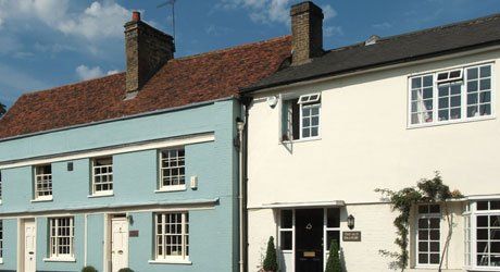 Two buildings one in white and blue colour