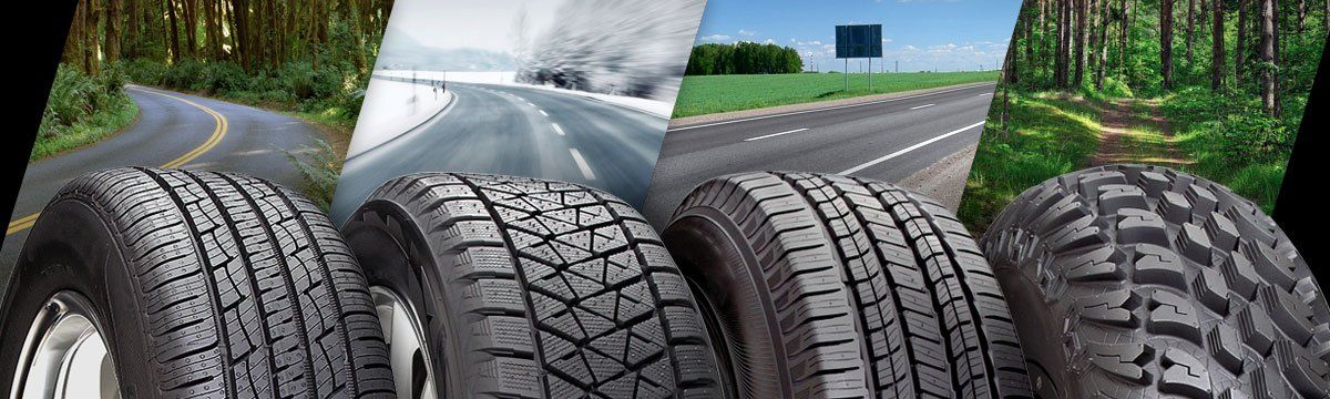 a group of tires are sitting next to each other on a road .