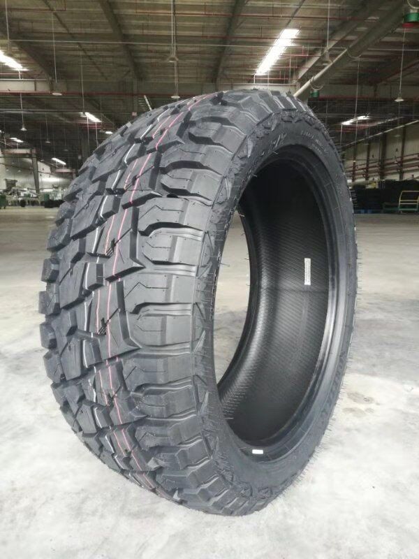 a tire is sitting on the ground in a warehouse .