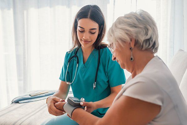 Medical Malpractice Law Firm — Nurse Measuring Blood Pressure in Chicago, IL