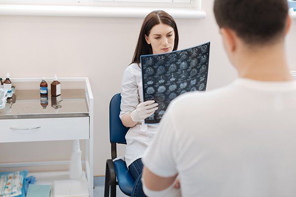 Brain Injury Claim — Doctor Examining the X-ray Photo in Chicago, IL