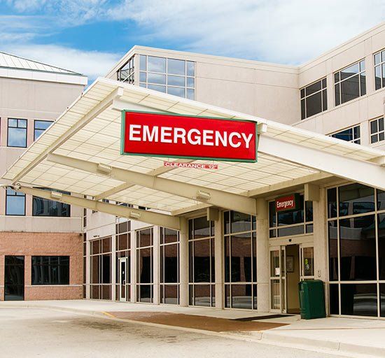 Emergency room entrance at a hospital with a large red 