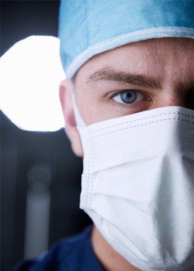 Doctor in surgical gear.
