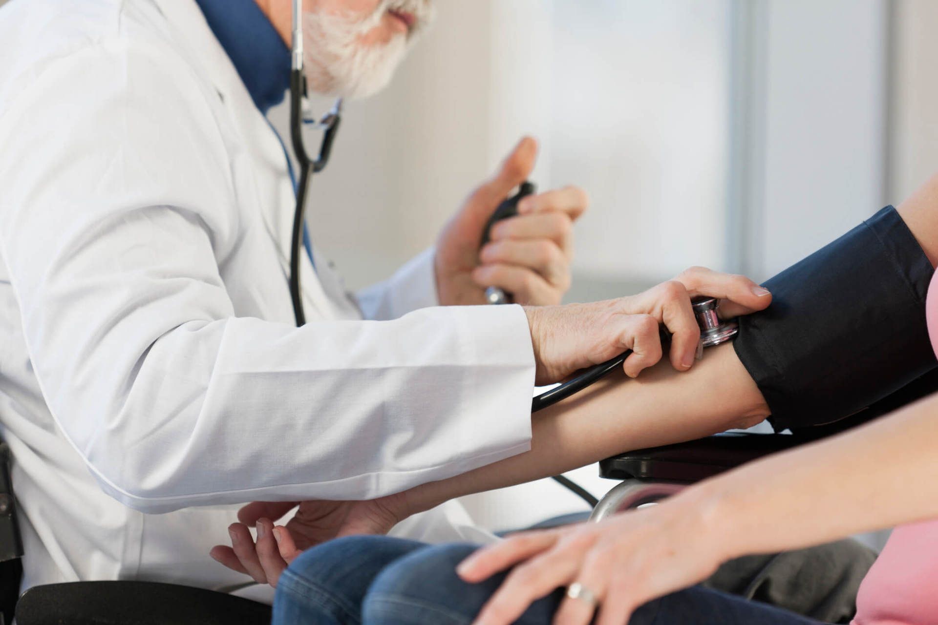 Malpractice Attorney — Doctor Checking the Blood Pressure of a Patient in Chicago, IL Malpractice Attorney — Doctor Checking the Blood Pressure of a Patient in Chicago, IL