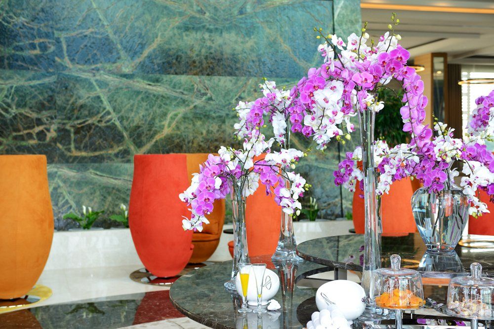 Purple And White Flower Placed In The Lobby — Bergenfield, New Jersey — Brodericks Flowers & Gifts Inc