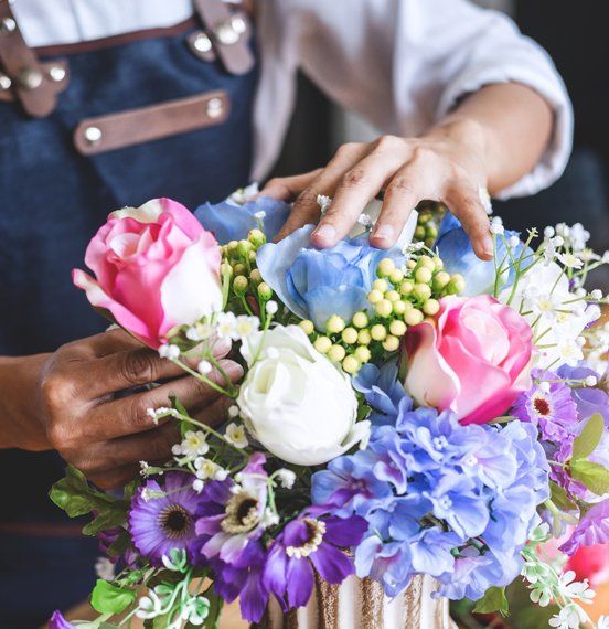 A Floral Designer Arranging Flowers — Bergenfield, New Jersey — Brodericks Flowers & Gifts Inc A Floral Designer Arranging Flowers — Bergenfield, New Jersey — Brodericks Flowers & Gifts Inc