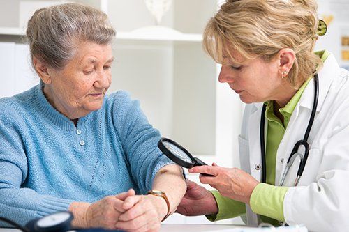 Nashville Dermatology — Doctor Check Old Woman's Arms in Nashville, TN Nashville Dermatology — Doctor Check Old Woman's Arms in Nashville, TN