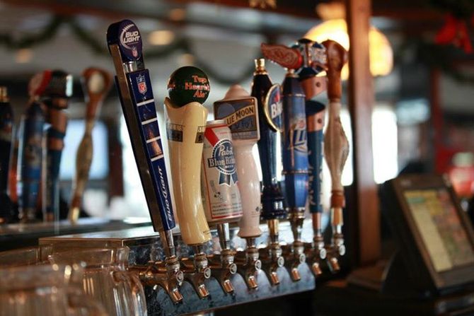 A bar with a lot of beer taps on it