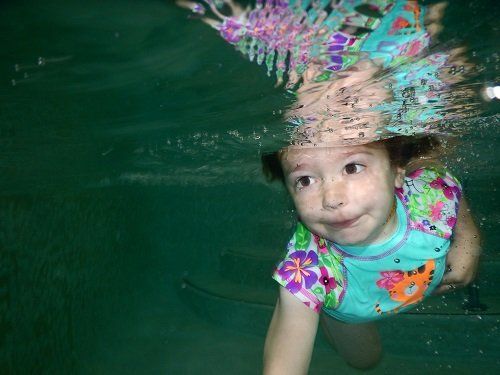 child swimming underwater