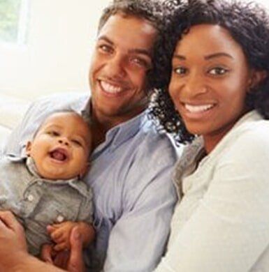 Happy Family — Family Dental Center in Cambria Heights, NY Happy Family — Family Dental Center in Cambria Heights, NY