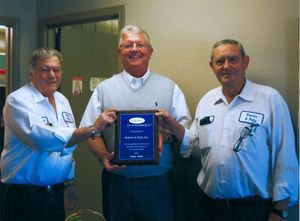 Roberts and Petty Inc receiving an honorary plaque from Carrier