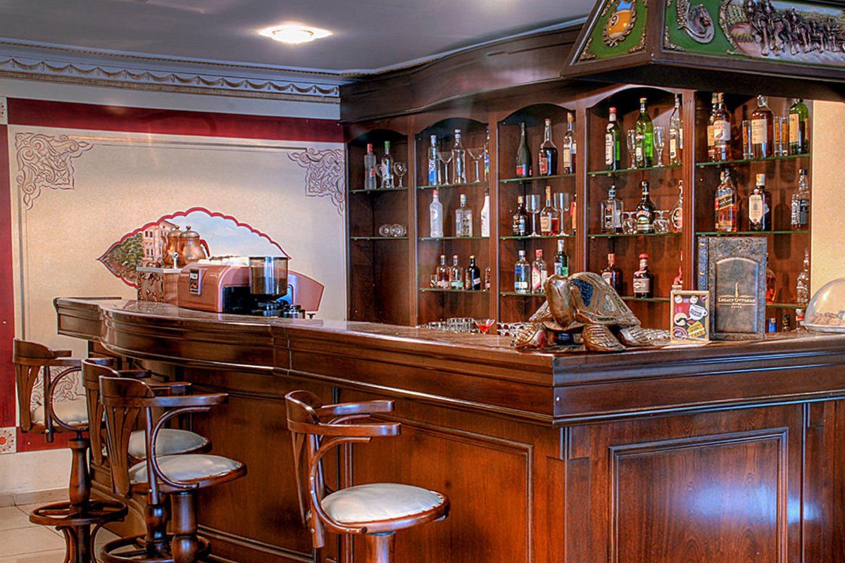 A bar with a lot of bottles on it