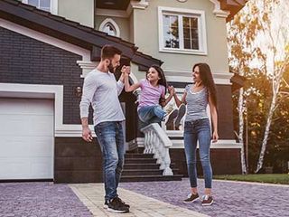 Home Insurance Quote — Couple and Child Outside Home in Milwaukee, WI