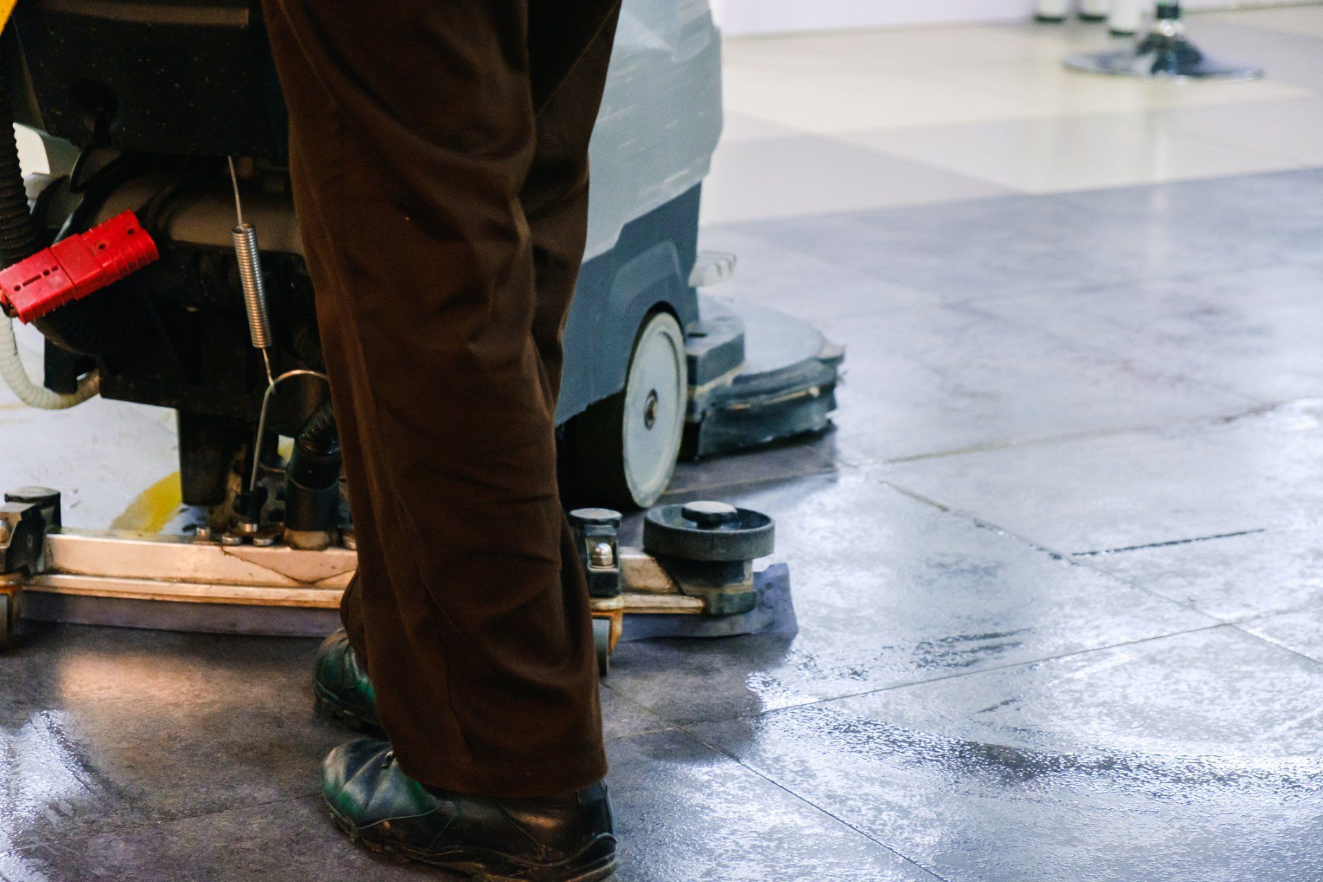 Metro Maintainers makes sure your floors are clean every time we visit Janitor using machine to clean floors