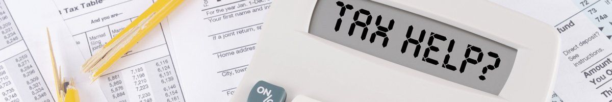 calculator on top of tax documents