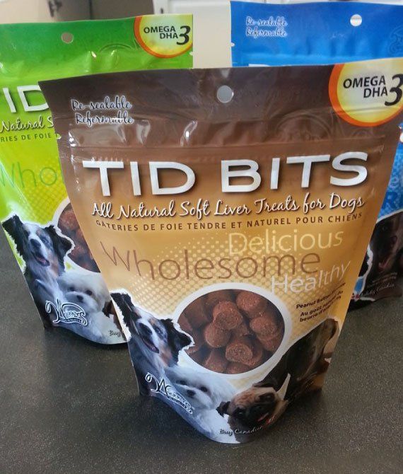 Bag of TIBITS dog treats with brown and white packaging, visible dog photos, on a shelf