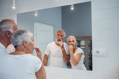 Family Dentist — Old Couple Brushing Their Teeth in Lexington, NE Family Dentist — Old Couple Brushing Their Teeth in Lexington, NE