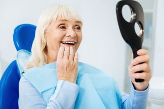 Quality Dental Care — Old Lady Looking Herself At The Mirror in Lexington, NE