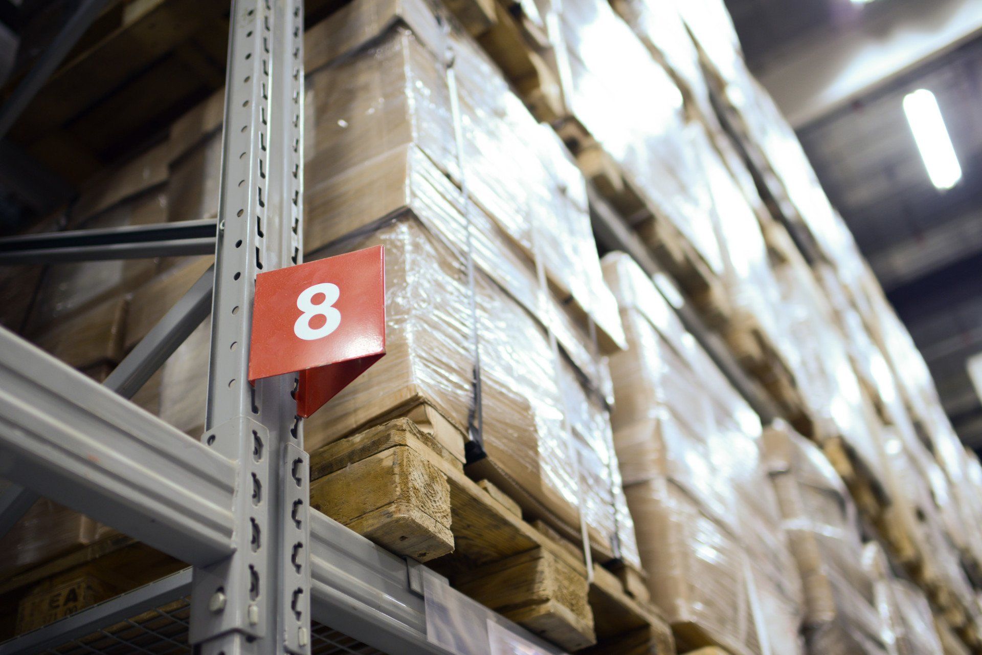 warehouse shelves stacked with boxes