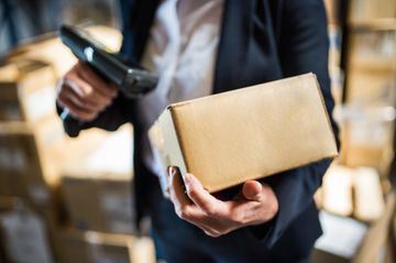 woman scanning delivery package