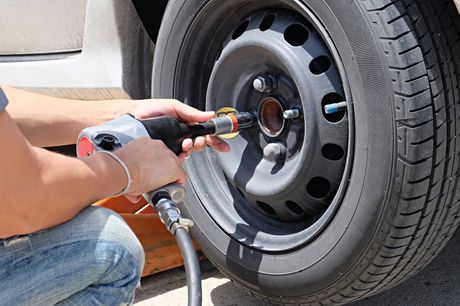 someone changing the car tire