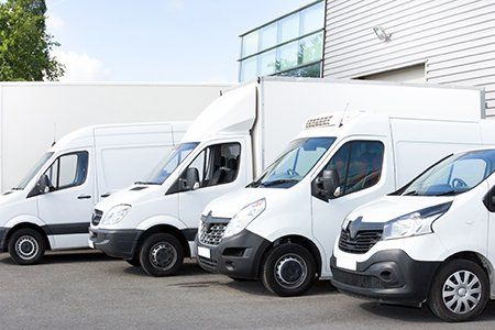 Several Vans Parked in Parking Lot — Boynton Beach, FL — Insurance World Several Vans Parked in Parking Lot — Boynton Beach, FL — Insurance World