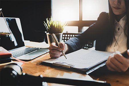 Woman Hoding Pen With Contract — Boynton Beach, FL — Insurance World Woman Hoding Pen With Contract — Boynton Beach, FL — Insurance World
