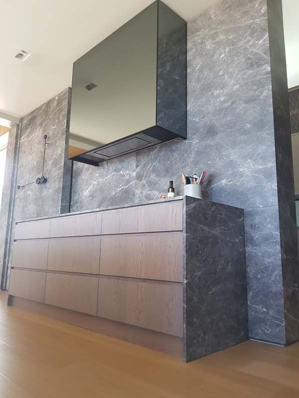 drawers and marble walls