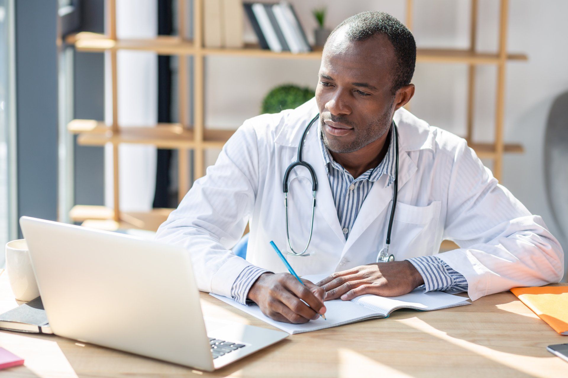 Raleigh — Doctor Working on Consultation in Raleigh, NC Raleigh — Doctor Working on Consultation in Raleigh, NC