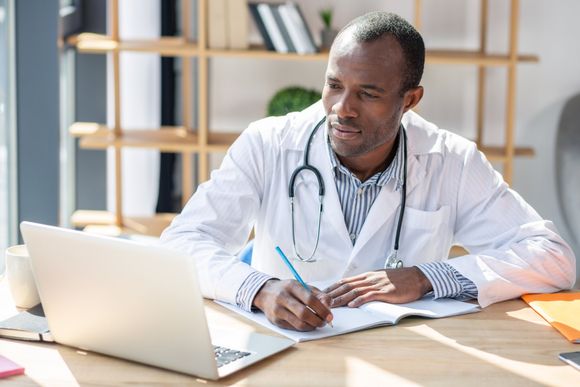 Raleigh — Doctor Working on Consultation in Raleigh, NC Raleigh — Doctor Working on Consultation in Raleigh, NC