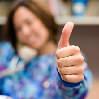 Woman Making a Phone Call and Thumbs Up Gesture — Pest Control in Danville, VA