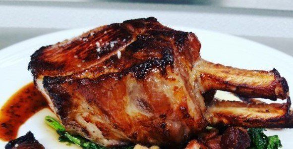 A close up of a piece of meat on a plate.