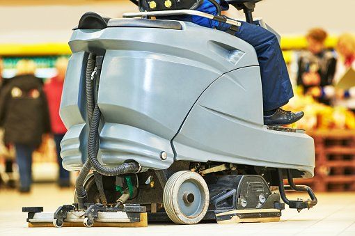 Worker cleaning floor - Flooring Care & Maintenance in Santa Cruz, CA