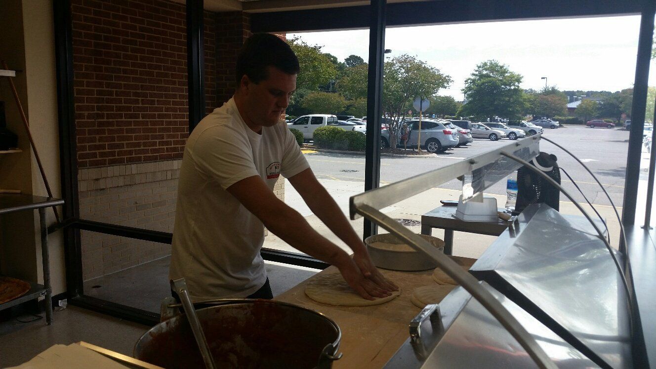 kneading pizza dough