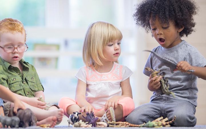 children playing animal and dinosaur toys children playing animal and dinosaur toys