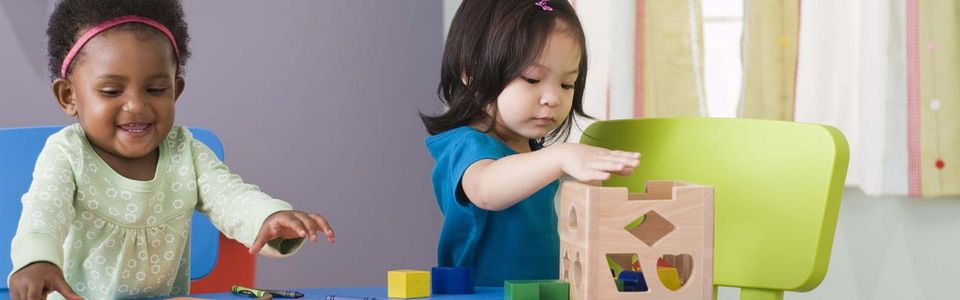 infants playing toys on the table