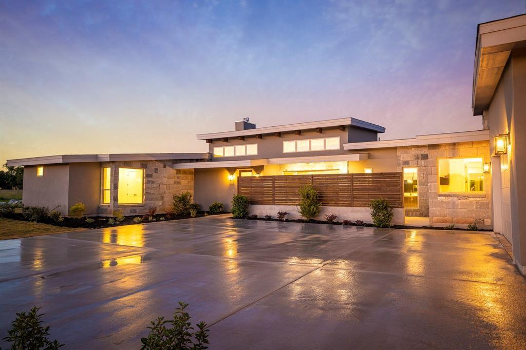 Front Exterior and Driveway lit in Evening
