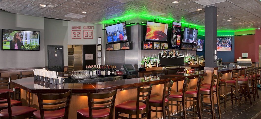 Guys Drinking While Watching Television in Bar — Sound Technician in Washington, D.C. Metro