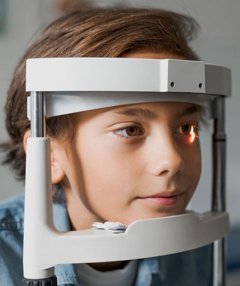 Boy Checking Vision With Tonometer — Youngstown, OH — Union Eyes Optical Inc Boy Checking Vision With Tonometer — Youngstown, OH — Union Eyes Optical Inc