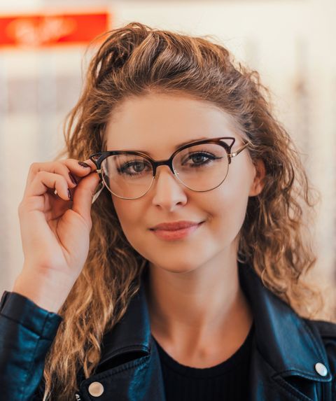Woman Trying Glasses at the Optician — Youngstown, OH — Union Eyes Optical Inc Woman Trying Glasses at the Optician — Youngstown, OH — Union Eyes Optical Inc