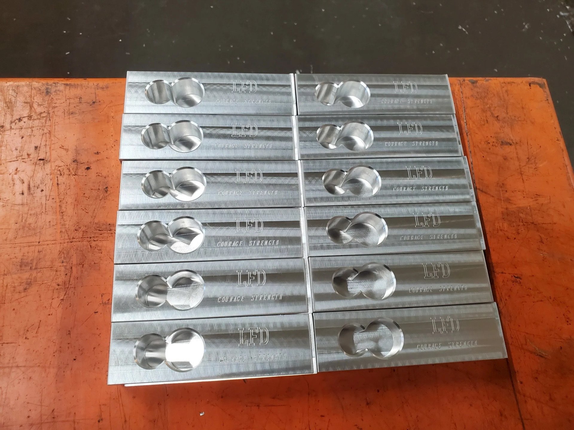 A bunch of metal bars stacked on top of each other on a table