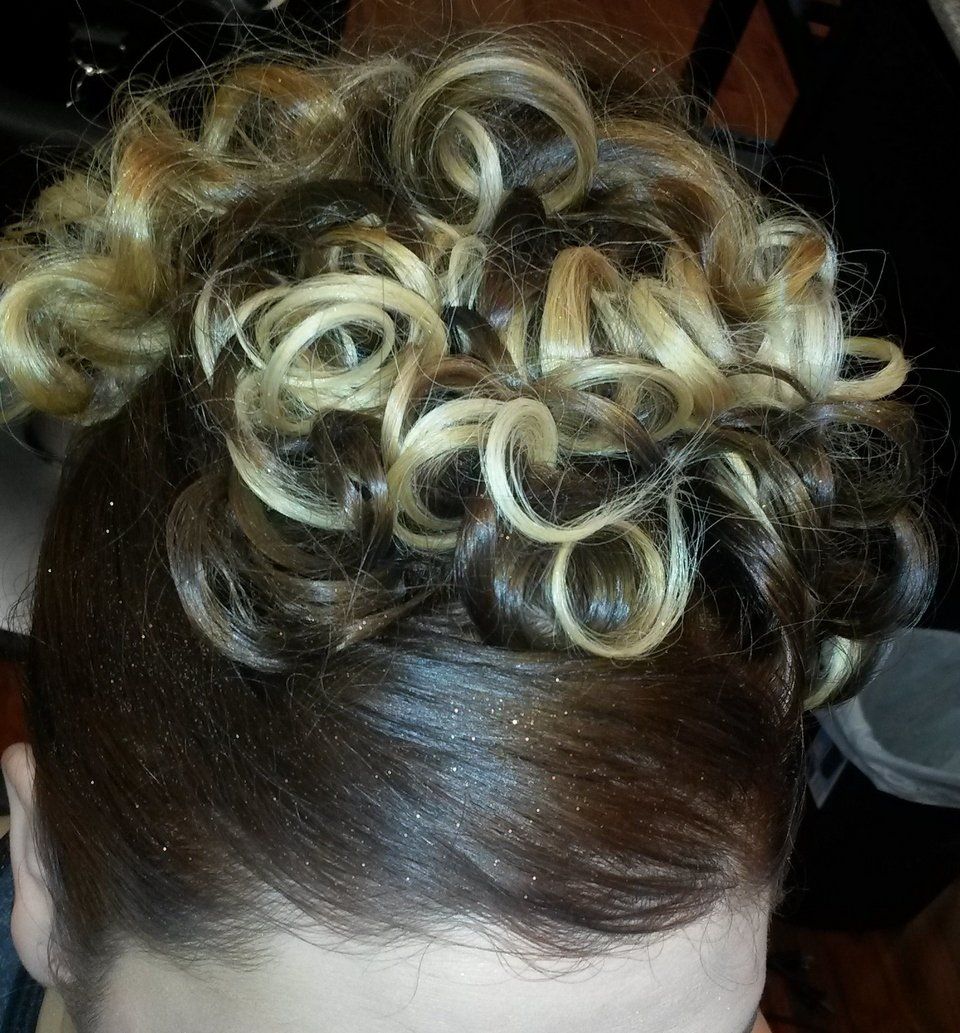 A close up of a woman's hair in a bun.