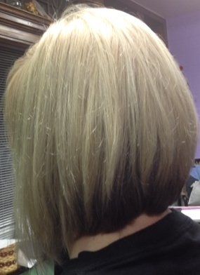 A close up of a person's hair with a bob hairstyle.