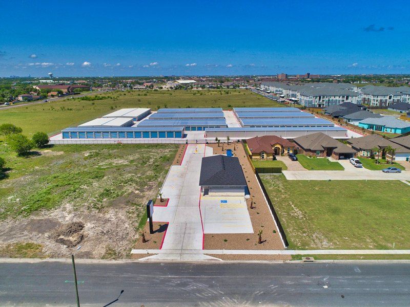 An Aerial View Of A Residential Area With A Lot Of Houses And Buildings - Corpus Christi, TX - Lock & Key Storage