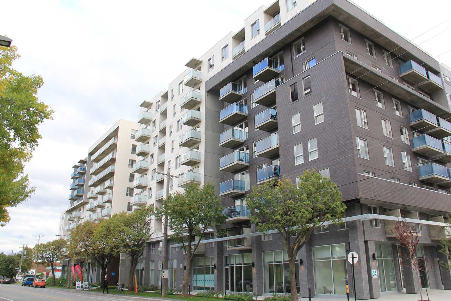 A large apartment building with a lot of windows and balconies