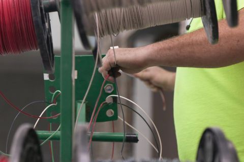 Electrician Pulls Wire from Reels