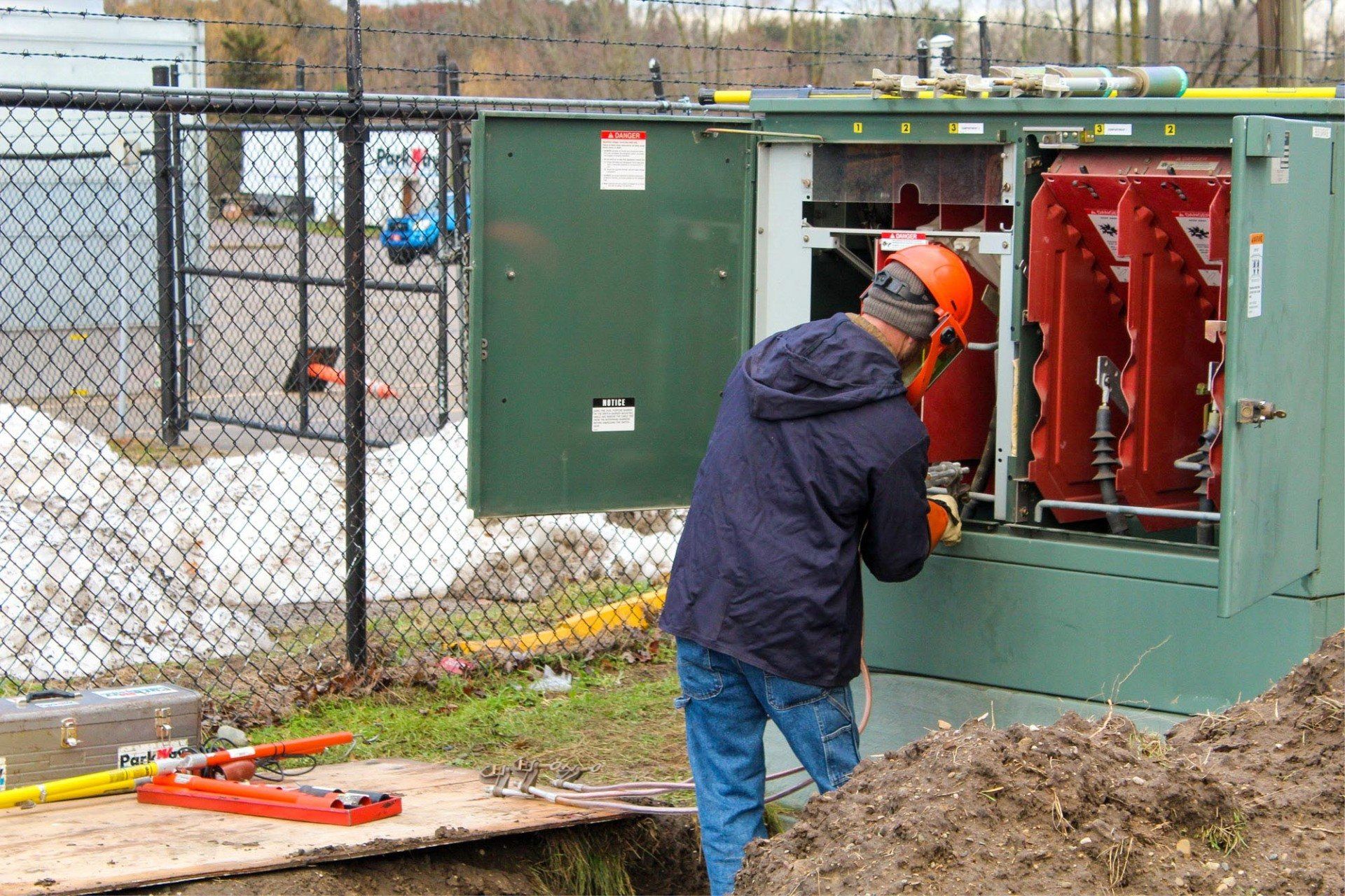 Electrician working on power boxes